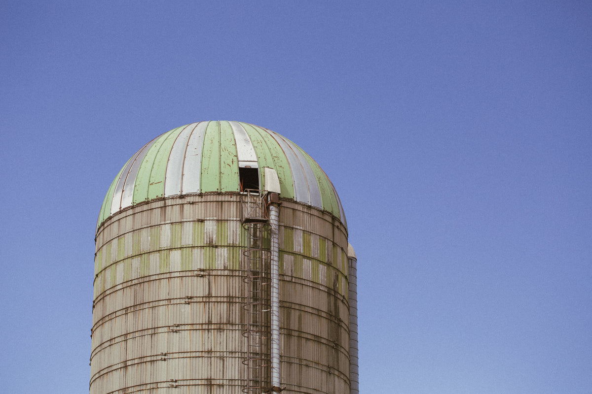 Farm silo against a blue sky